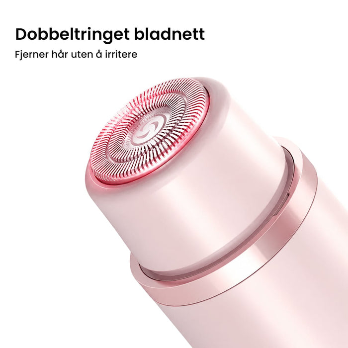 Nærbilde av et rosa skjærehode til Kroppstrimmer Ultra med roterende dobbelringblad for ansikt og kropp.