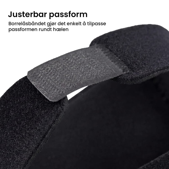 Svart hælbeskyttelse mot hælspore (1 par) med justerbar borrelås for å avlaste ømme hæler.