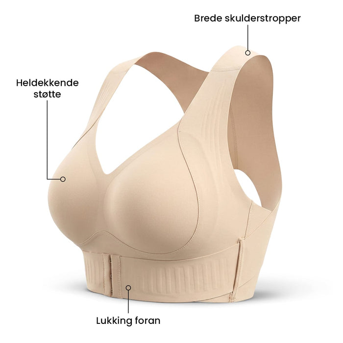 Beige Trueform-BH med formende effekt, brede skulderstropper, lukking foran og markerte detaljer.